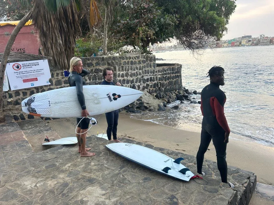 Surfers preparing for a session on Ngor Island.