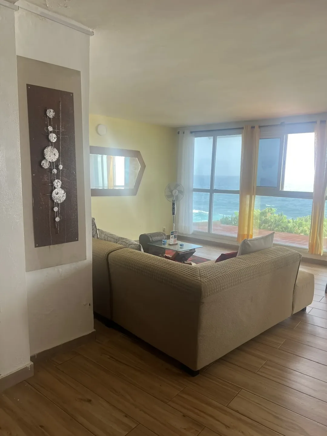 Cozy surf camp living area with ocean view.