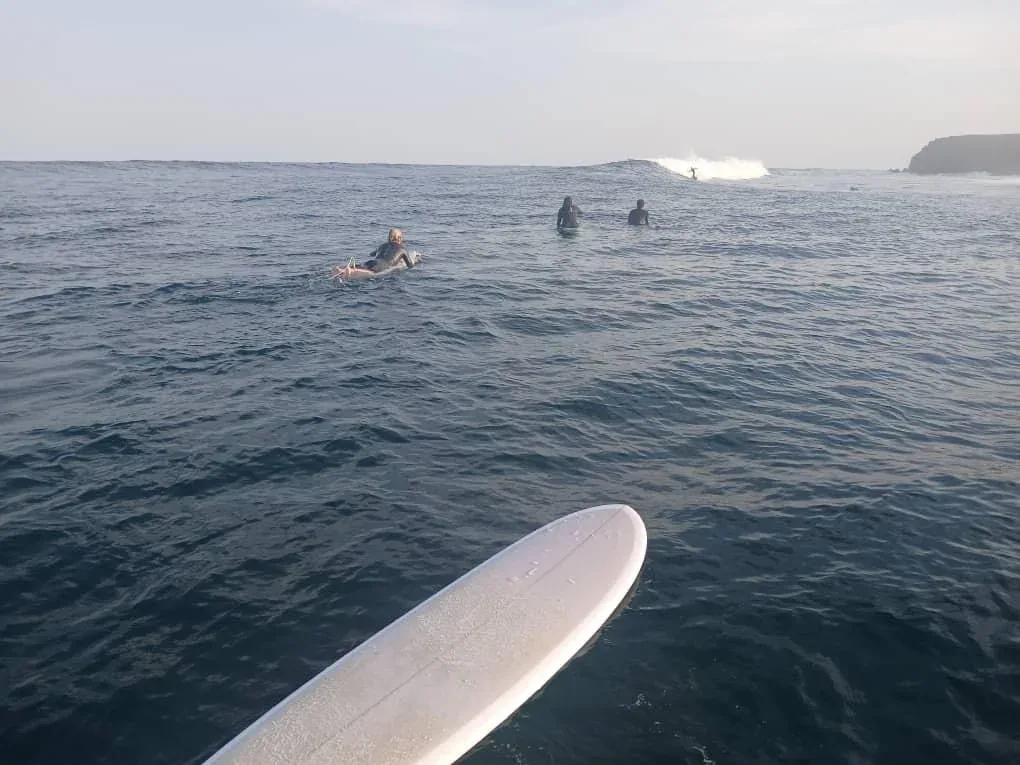 Surfers waiting for the perfect wave.