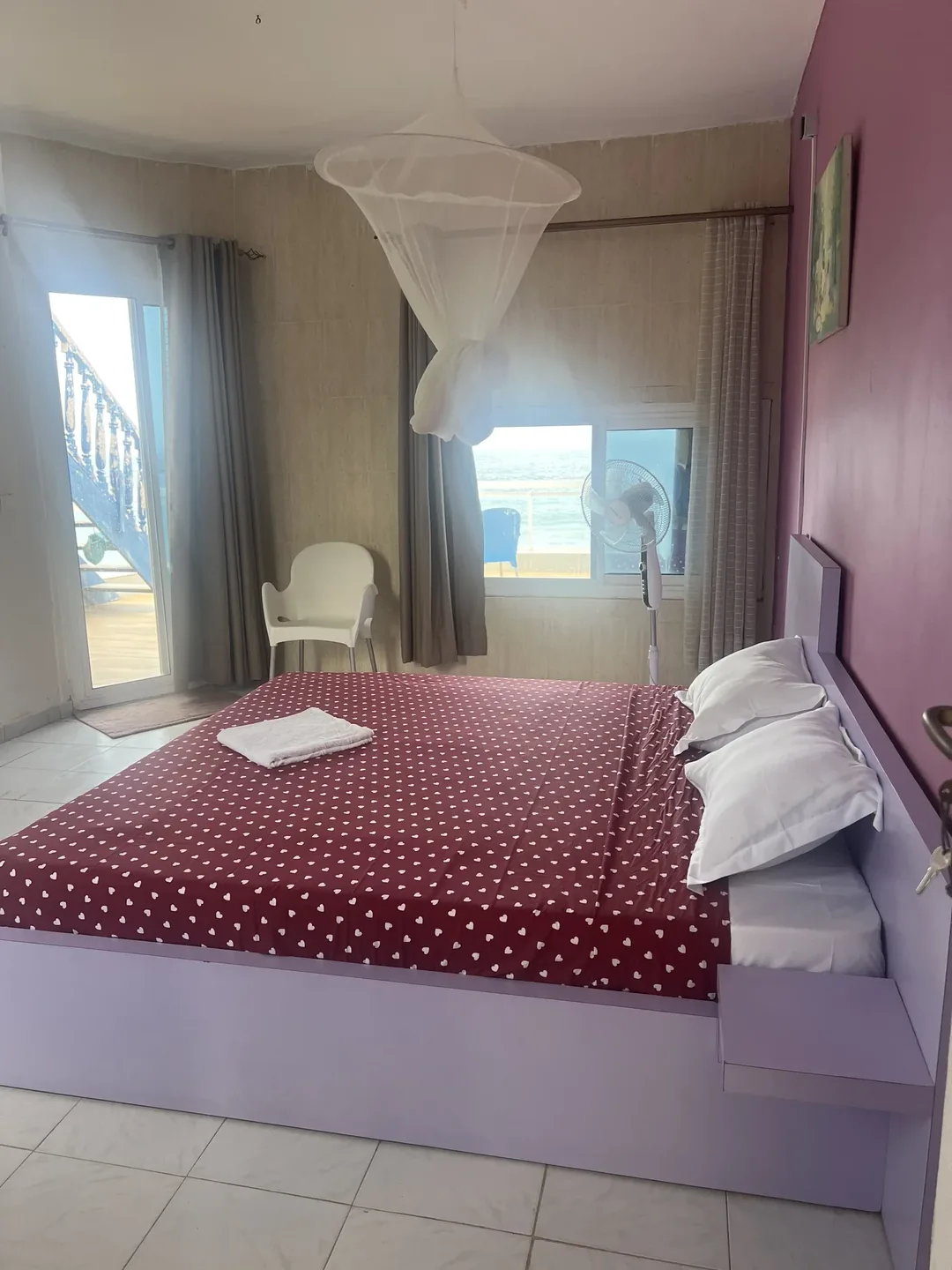 Cozy bedroom with ocean view.