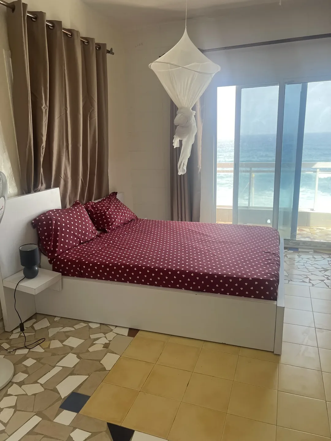 Cozy bedroom with ocean view.