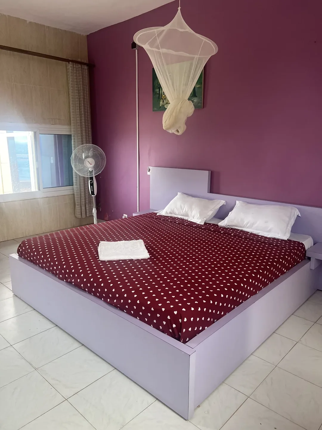 Cozy bedroom with purple accents.