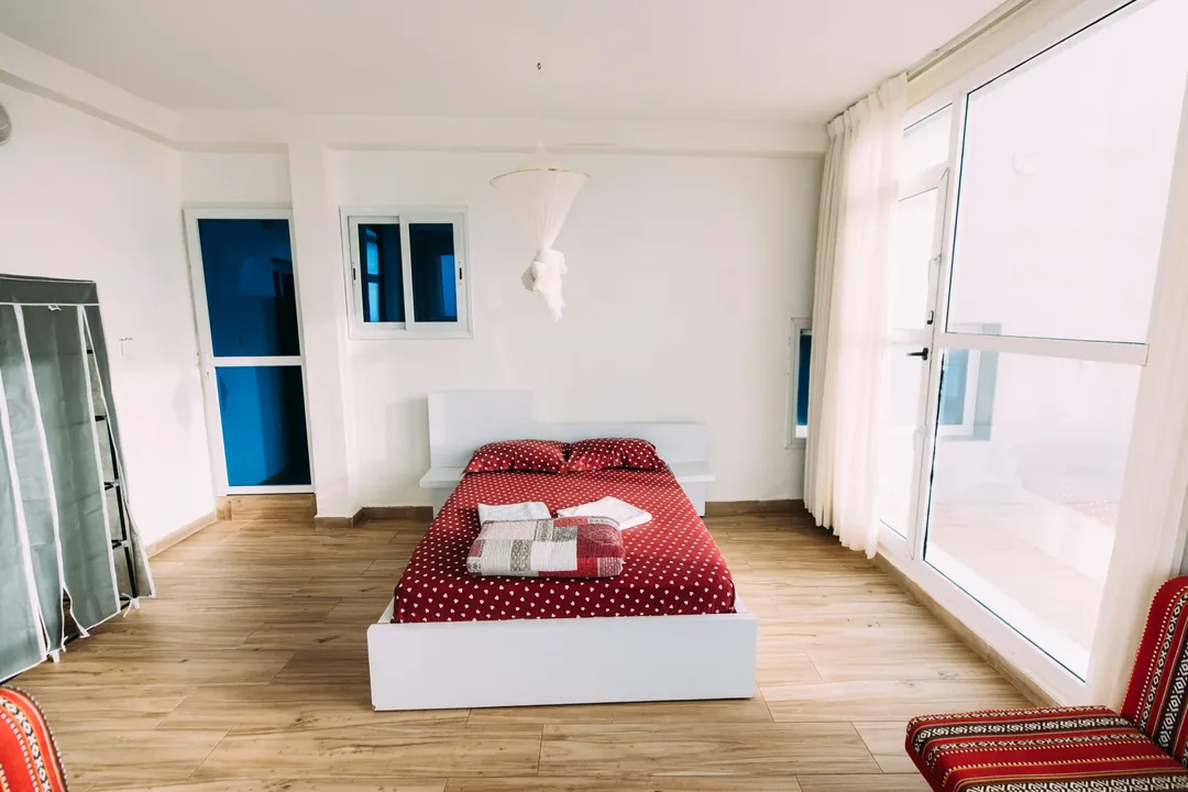 Bright room with red polka dot bedding.