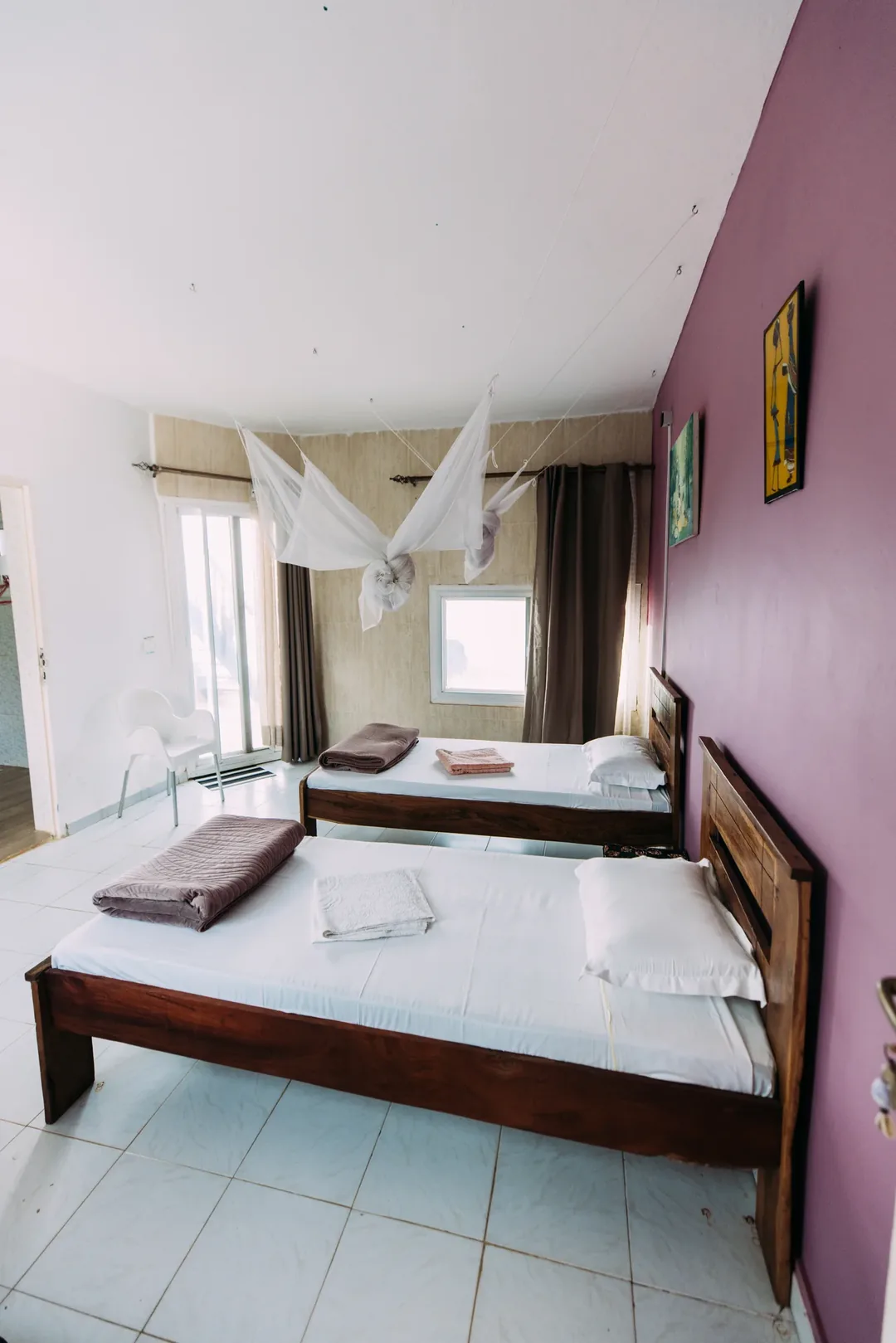 Cozy twin room with mosquito netting.